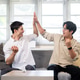 Asian man looking and clapping hand with friend as watching sport or football on sofa in living room Asian man looking and clapping hand with friend as watching sport or football on sofa in living room - PhotoDune Item for Sale