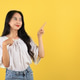 Asian Teenager with Long Hair and Casual Fashion, Pointing on Top Asian Teenager with Long Hair and Casual Fashion, Pointing on Top - PhotoDune Item for Sale