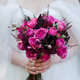 Closeup of caucasian bride holding a beautiful bouquet of colorful fresh flowers in her hands. Closeup of caucasian bride holding a beautiful bouquet of colorful fresh flowers in her hands. - PhotoDune Item for Sale