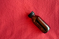 Mock-up amber glass bottle on a red background Mock-up amber glass bottle on a red background - PhotoDune Item for Sale