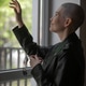 portrait of a young girl with a shaved head, she looks out the window with hope portrait of a young girl with a shaved head, she looks out the window with hope - PhotoDune Item for Sale