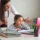 Furious adult woman screaming at daughter while she helping to do her homework assignment at home Furious adult woman screaming at daughter while she helping to do her homework assignment at home - PhotoDune Item for Sale