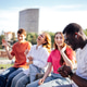 Group of diverse young friends enjoying time together outdoors Group of diverse young friends enjoying time together outdoors - PhotoDune Item for Sale