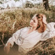 Peaceful Autumn Portrait of a Woman Lying in Dry Grass Peaceful Autumn Portrait of a Woman Lying in Dry Grass - PhotoDune Item for Sale