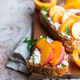 Open sandwiches with tartine bread and cream cheese, nectarine and apricot drizzled with honey Open sandwiches with tartine bread and cream cheese, nectarine and apricot drizzled with honey - PhotoDune Item for Sale