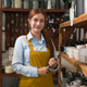 Smiling shopkeeper with tablet in a store filled with ceramics and kitchenware Smiling shopkeeper with tablet in a store filled with ceramics and kitchenware - PhotoDune Item for Sale