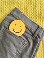 Top & jeans flat lay in Ultimate Gray & Illuminating colors & a happy face in pocket carting a smile Top & jeans flat lay in Ultimate Gray & Illuminating colors & a happy face in pocket carting a smile - PhotoDune Item for Sale