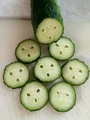 Green Flat Lay. Cutting this cucumber I realized it looks like the surprise face of an emoji. Green Flat Lay. Cutting this cucumber I realized it looks like the surprise face of an emoji. - PhotoDune Item for Sale
