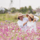 Happy Asian Senior Women Sharing Joy in Pink Flower Field Happy Asian Senior Women Sharing Joy in Pink Flower Field - PhotoDune Item for Sale