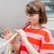A teenage girl learns to play the flute and rehearses at home.music as a hobby for teenagers A teenage girl learns to play the flute and rehearses at home.music as a hobby for teenagers - PhotoDune Item for Sale