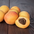 Some Fresh Apricots On Brown Table Some Fresh Apricots On Brown Table - PhotoDune Item for Sale