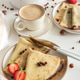 Crepes with chocolate hazelnut spread, strawberries and hazelnuts on a white wooden table. Crepes with chocolate hazelnut spread, strawberries and hazelnuts on a white wooden table. - PhotoDune Item for Sale