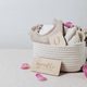 Delicate sweaters and booties for newborns in a rope basket on a stone background. Delicate sweaters and booties for newborns in a rope basket on a stone background. - PhotoDune Item for Sale