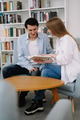 Attractive smiling happy skilled young couple of freelancers sitting at their workplace at home and Attractive smiling happy skilled young couple of freelancers sitting at their workplace at home and - PhotoDune Item for Sale