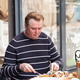 middle-aged man having lunch on the summer terrace of a cafe middle-aged man having lunch on the summer terrace of a cafe - PhotoDune Item for Sale