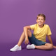 Positive Caucasian preteen boy in bright trendy outfit smiling and looking at camera Positive Caucasian preteen boy in bright trendy outfit smiling and looking at camera - PhotoDune Item for Sale