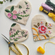 Linen heart with floral embroidery, vintage scissors, needle and thread flat lay Linen heart with floral embroidery, vintage scissors, needle and thread flat lay - PhotoDune Item for Sale