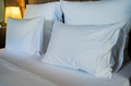 Close up white pillows on a bed Close up white pillows on a bed - PhotoDune Item for Sale