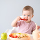 cute baby eating solid food sitting in a baby chair. weaning cute baby eating solid food sitting in a baby chair. weaning - PhotoDune Item for Sale