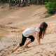 Energetic girl climbing up small hill on sandy beach near river. Little athlete actively spend time Energetic girl climbing up small hill on sandy beach near river. Little athlete actively spend time - PhotoDune Item for Sale
