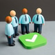 Office workers gathered around a green checkmark. Compromise and agreement. Office workers gathered around a green checkmark. Compromise and agreement. - PhotoDune Item for Sale