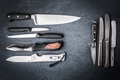Collection knives on a gray stone Collection knives on a gray stone - PhotoDune Item for Sale