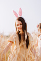Preteen girl in wheat field with easter bunny ears. Teen girl portrait enjoying sunny day Preteen girl in wheat field with easter bunny ears. Teen girl portrait enjoying sunny day - PhotoDune Item for Sale