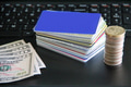 Credit Cards and Coins Pile with Fifty Dollar Bills on Laptop for Finances and Economy Concept. Credit Cards and Coins Pile with Fifty Dollar Bills on Laptop for Finances and Economy Concept. - PhotoDune Item for Sale