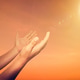 A man praying hand for blessings When the sun goes down Hope for a happy life A man praying hand for blessings When the sun goes down Hope for a happy life - PhotoDune Item for Sale