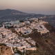Cliffside homes in Santorini at sunset in summer Cliffside homes in Santorini at sunset in summer - PhotoDune Item for Sale