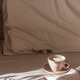 Cappuccino Cup on Cozy Bed with Sunlight and Beige Bedding Cappuccino Cup on Cozy Bed with Sunlight and Beige Bedding - PhotoDune Item for Sale