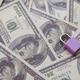 Safeguarding Your Wealth: Lock on Hundred-Dollar Bills Investment Protection Financial Safety. Safeguarding Your Wealth: Lock on Hundred-Dollar Bills Investment Protection Financial Safety. - PhotoDune Item for Sale