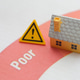 a house with a yellow warning sign "Poor" rating, the dangers substandard real estate investments. a house with a yellow warning sign "Poor" rating, the dangers substandard real estate investments. - PhotoDune Item for Sale