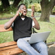 Excited Black Man Celebrating Success on Phone with Laptop in Park Excited Black Man Celebrating Success on Phone with Laptop in Park - PhotoDune Item for Sale