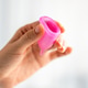 Reusable Menstrual Cup in Female Hands Reusable Menstrual Cup in Female Hands - PhotoDune Item for Sale