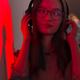 Smiling woman with headphones in red neon light listening to music, electronic sound of nightclub Smiling woman with headphones in red neon light listening to music, electronic sound of nightclub - PhotoDune Item for Sale