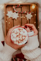 Close up of women's hands holding white mug with hot cocoa, tea or coffee and marshmallow. Close up of women's hands holding white mug with hot cocoa, tea or coffee and marshmallow. - PhotoDune Item for Sale