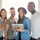 Smiling confident informal young businesspeople Smiling confident informal young businesspeople - PhotoDune Item for Sale