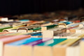 Used second hand books for sale on a book market stall in perspective bright colors on a table. Used second hand books for sale on a book market stall in perspective bright colors on a table. - PhotoDune Item for Sale