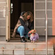 Woman preparing dachshund dog for autumn walk Woman preparing dachshund dog for autumn walk - PhotoDune Item for Sale