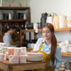 Young woman working in a pottery shop, organizing handmade ceramic dishes Young woman working in a pottery shop, organizing handmade ceramic dishes - PhotoDune Item for Sale