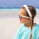 Young girl with braids and sunglasses enjoying a beach view Young girl with braids and sunglasses enjoying a beach view - PhotoDune Item for Sale