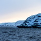 view of sea water surface and snow-covered cliff view of sea water surface and snow-covered cliff - PhotoDune Item for Sale