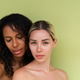 Woman close beauty portrait mixed race black skin and white skin, two female on green background Woman close beauty portrait mixed race black skin and white skin, two female on green background - PhotoDune Item for Sale