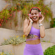A Joyful Young Woman Dancing Outdoors Enthusiastically While Wearing Headphones with Rhythm A Joyful Young Woman Dancing Outdoors Enthusiastically While Wearing Headphones with Rhythm - PhotoDune Item for Sale
