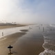 California Beach With Surfers and Tourists in Morning California Beach With Surfers and Tourists in Morning - PhotoDune Item for Sale