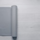 A Grey Yoga Mat Rolled and Ready for Use on a Light Wooden Floor, Perfect for Yoga, Pilates A Grey Yoga Mat Rolled and Ready for Use on a Light Wooden Floor, Perfect for Yoga, Pilates - PhotoDune Item for Sale