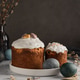 Easter still life with decorated homemade cakes, painted eggs and willow twigs on a table on a dark. Easter still life with decorated homemade cakes, painted eggs and willow twigs on a table on a dark. - PhotoDune Item for Sale
