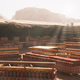Dining area in the desert with large tables and benches under a shaded tent Dining area in the desert with large tables and benches under a shaded tent - PhotoDune Item for Sale