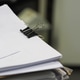 Stack of documents in focus with blurred office background, paperwork concept. Stack of documents in focus with blurred office background, paperwork concept. - PhotoDune Item for Sale